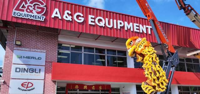 A&G Equipment premises in Johor with authorised Merlo, Dingli and EP distributor signs and a Dingli boom lift