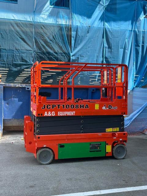 Battery scissor lifts lined up for servicing and indoor work in Johor
