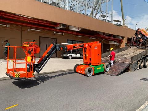 Boom lift extended at height during a rental job in Johor Bahru