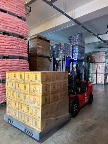 EP lithium-ion forklift moving pallets in a warehouse in Johor