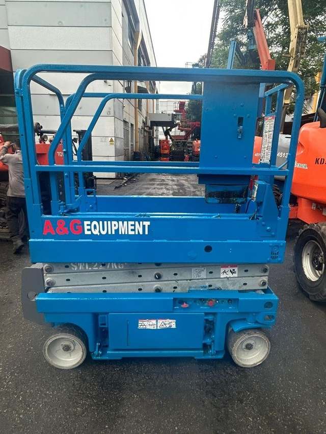 Genie scissor lift with A&G Equipment branding, stowed at an equipment yard – rental in Johor