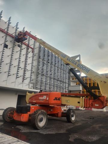 JLG 1250AJP boom lift working on a building facade job in Johor