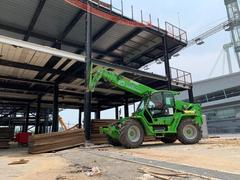 Merlo Panoramic telehandler under a steel structure on a construction site – telehandler rental in Johor